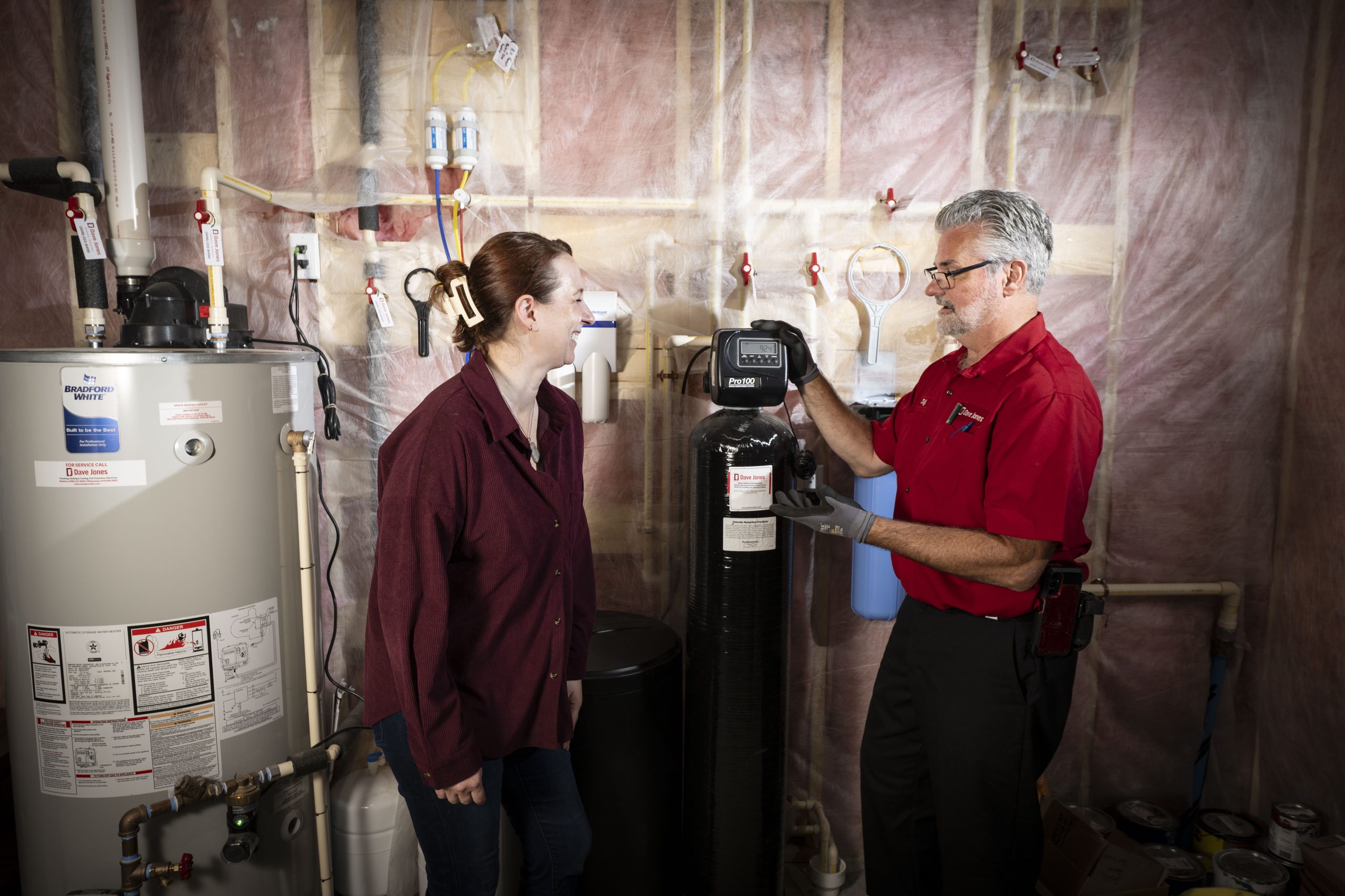 Dave Jones Plumber talking to homeowner at water softener