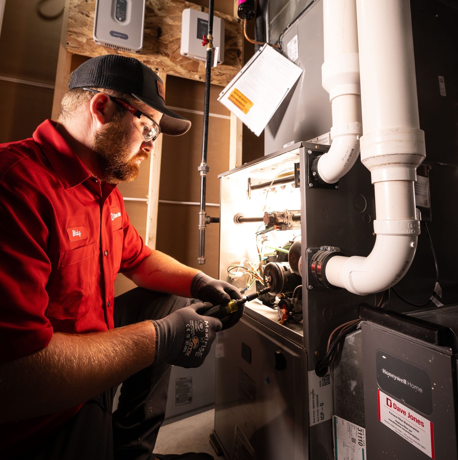 Dave Jones Technician working on furnace unit