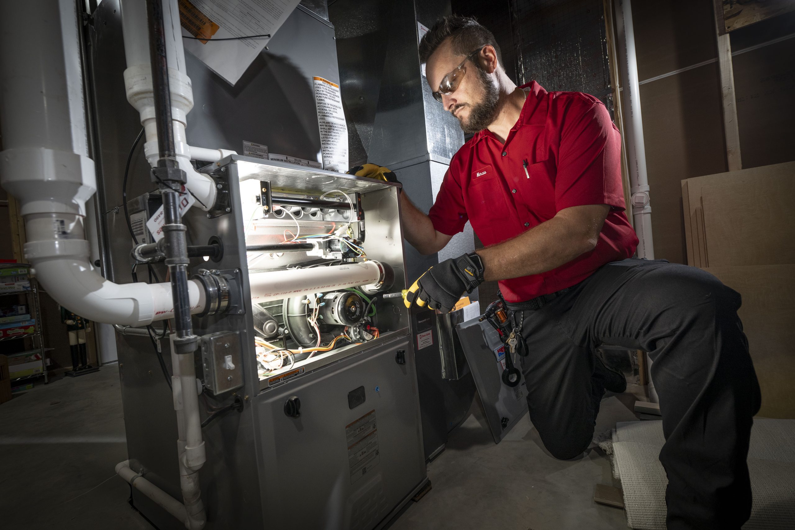 HVAC Technician at furnace in Madison, WI.