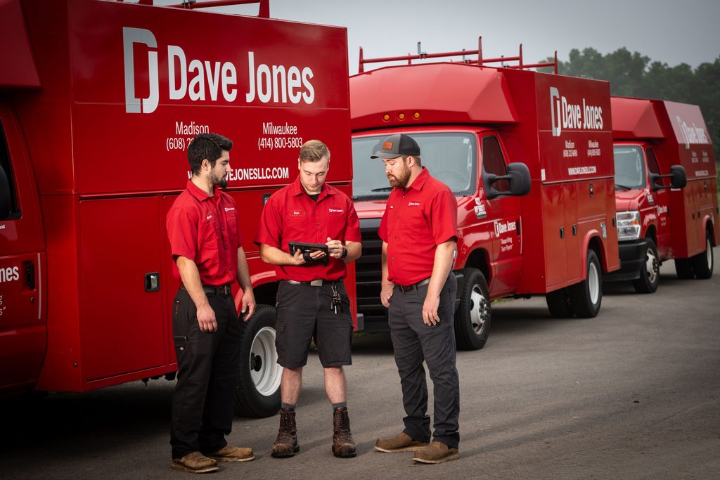 Dave Jones Technicians in front of their work vans.