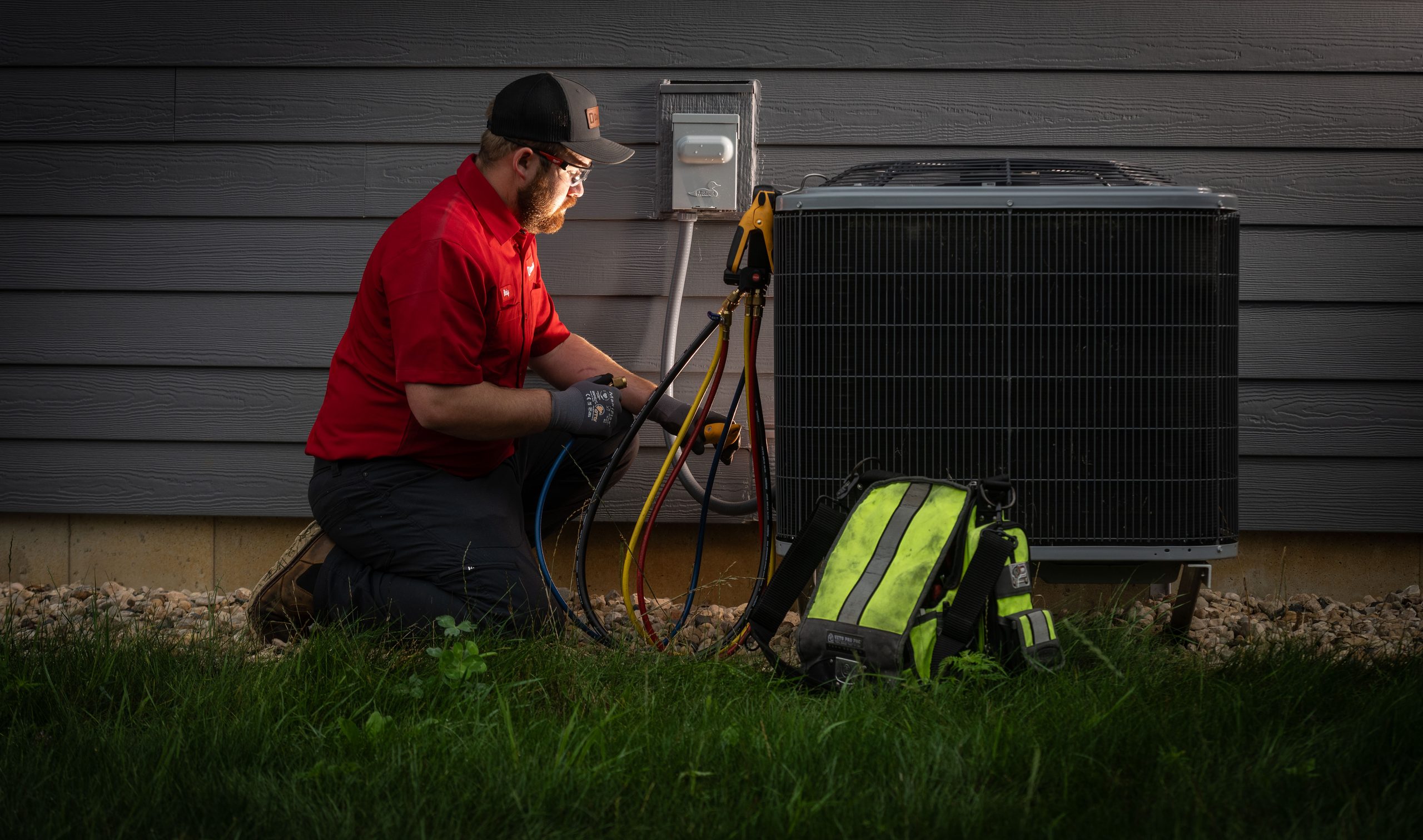 Dave Jones HVAC Technician checking Air Condenser