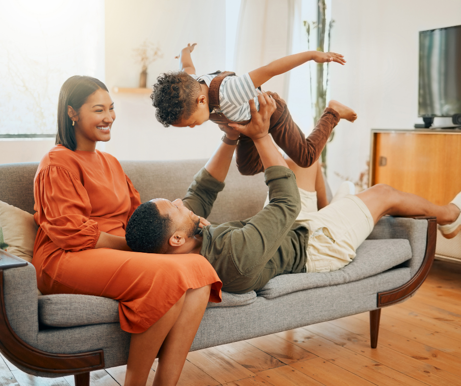 Family comfortable at home on couch